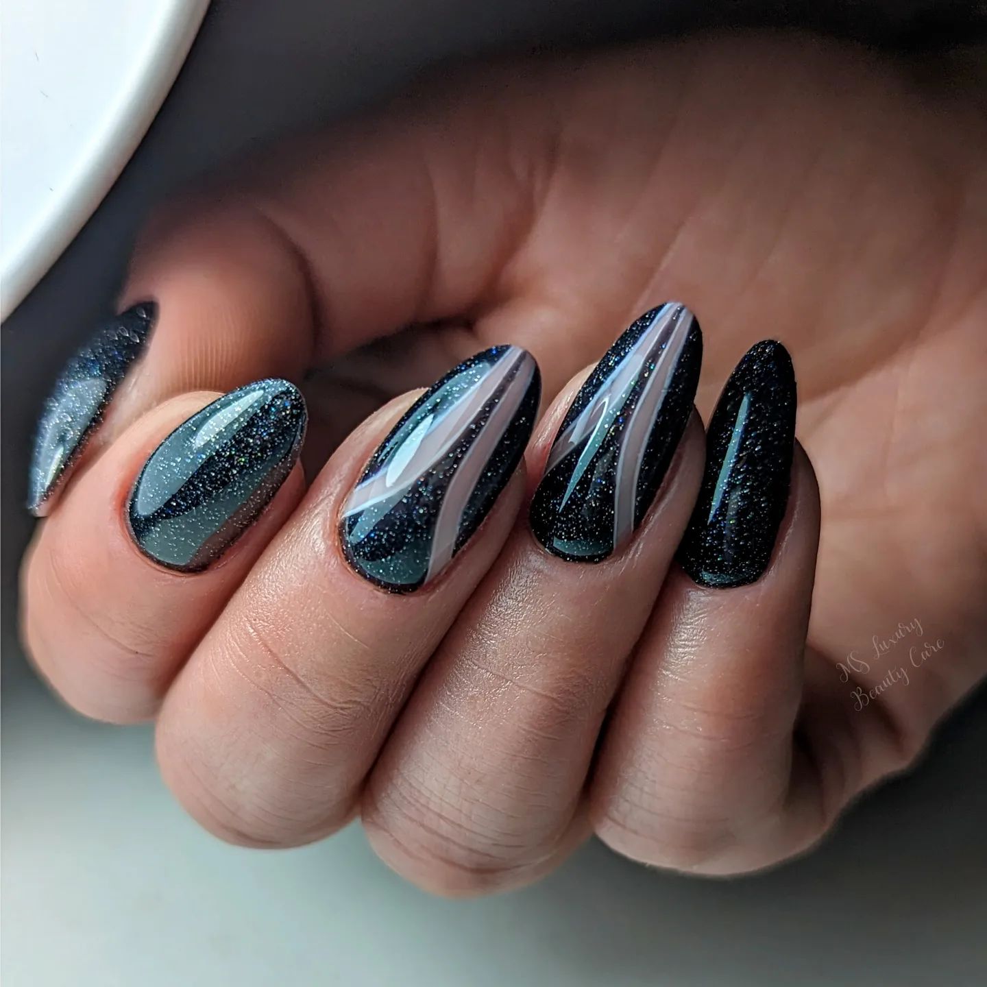 Black Polish with Glitters on Almond Nails