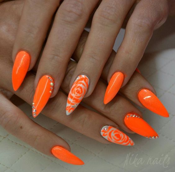 Orange Nails with Flowers and Rhinestones on Almond Nails