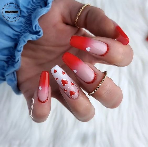 Red ombre French tips and red hearts nail art on long coffin nails